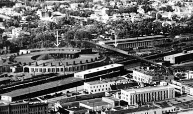 With a downtown gathering space in the works through the NDRC grant, is there a way to make  the bridge and the history it represents part of a true attraction for Minot? Note: the arrows in this picture have nothing to do with the downtown gathering space or the NDRC competition. The picture is from ~1935 and features the roundhouse on the Great Northern Railroad line.