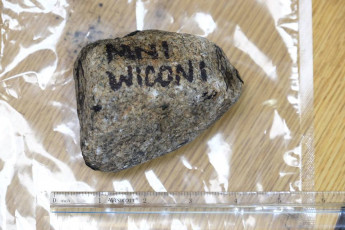 Rock provided as evidence of protester violence.