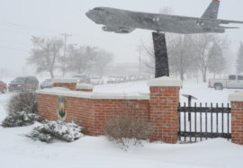 Snow whips past the B-52H Stratofortress static display on Minot Air Force Base, N.D., Nov. 25, 2014. The base, which is known for its austere weather conditions, is home to both the 5th Bomb Wing and 91st Missile Wing which support a strategic deterrence mission, operating and maintaining both B-52H Stratofortress bombers and Minuteman III intercontinental ballistic missiles. (U.S. Air Force photo/Senior Airman Stephanie Morris)