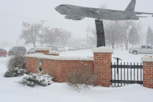 Snow whips past the B-52H Stratofortress static display on Minot Air Force Base, N.D., Nov. 25, 2014. The base, which is known for its austere weather conditions, is home to both the 5th Bomb Wing and 91st Missile Wing which support a strategic deterrence mission, operating and maintaining both B-52H Stratofortress bombers and Minuteman III intercontinental ballistic missiles. (U.S. Air Force photo/Senior Airman Stephanie Morris)