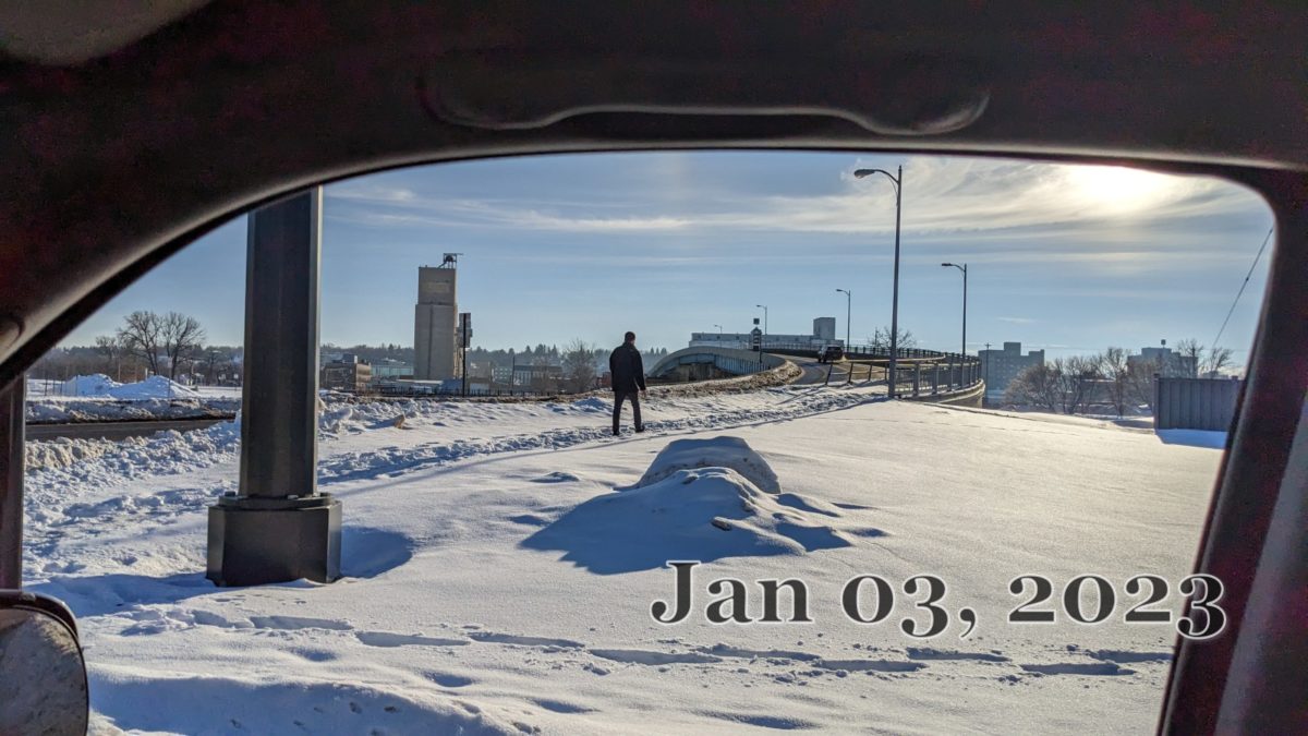 A pedestrian entering the North end of the 3rd St. Viaduct. 